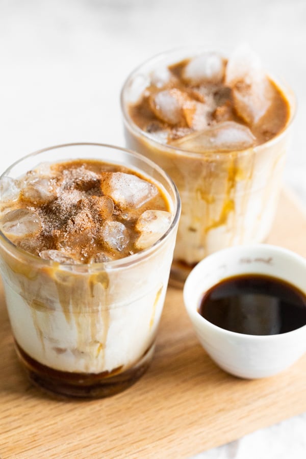 Apple Crisp Macchiato served on a wooden platter. 