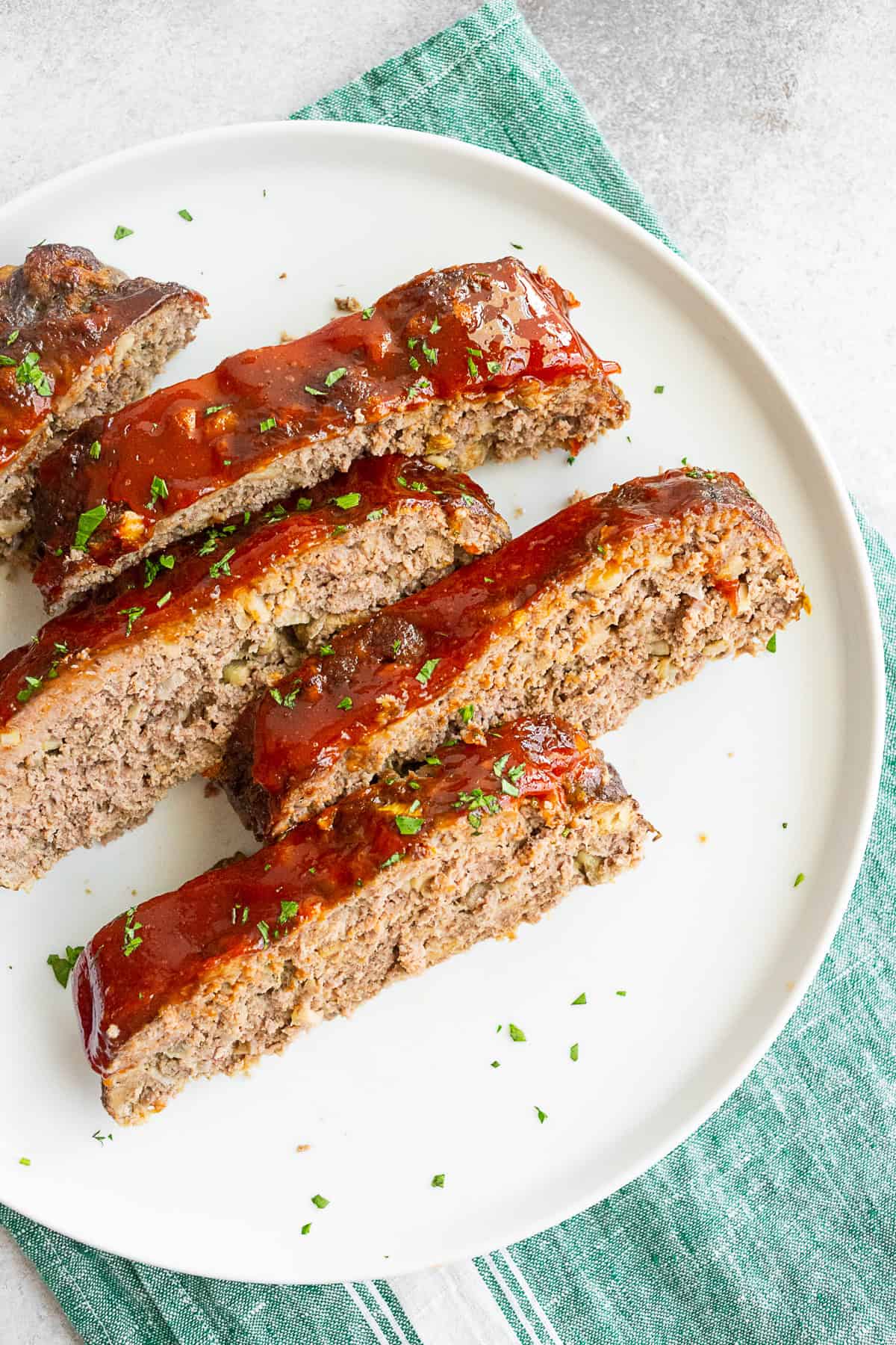 Classic Beef Meatloaf sliced into pieces for serving. 