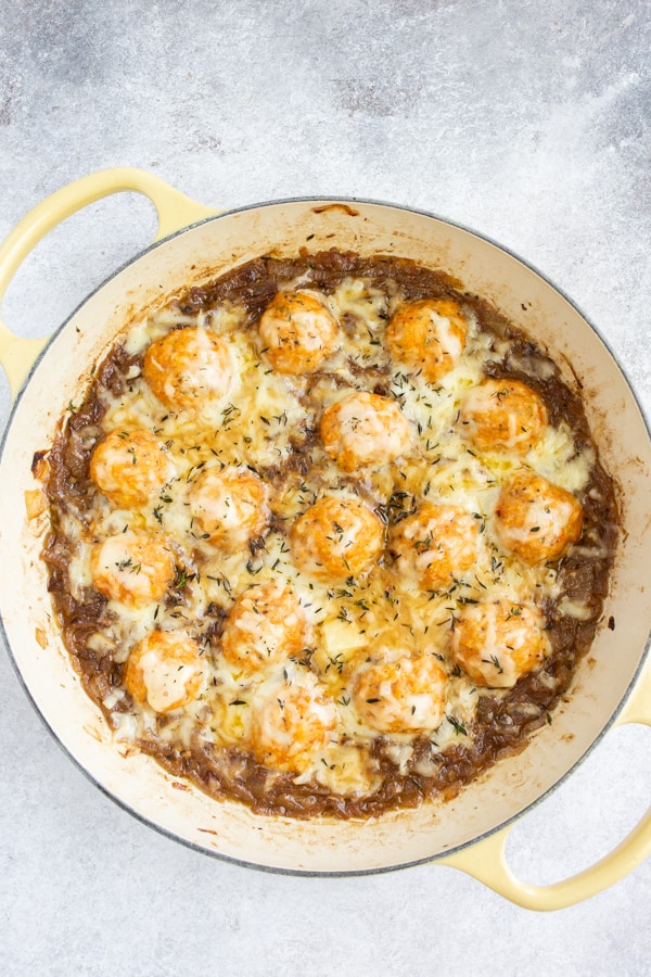 French Onion Chicken Meatballs in a pan topped with cheese. 