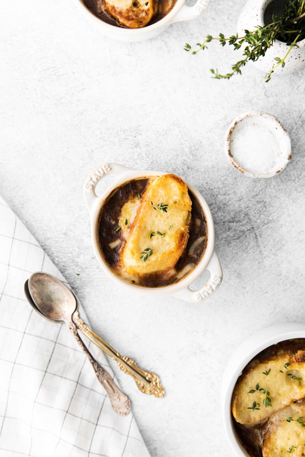French Onion Soup served in small white soup bowls. 