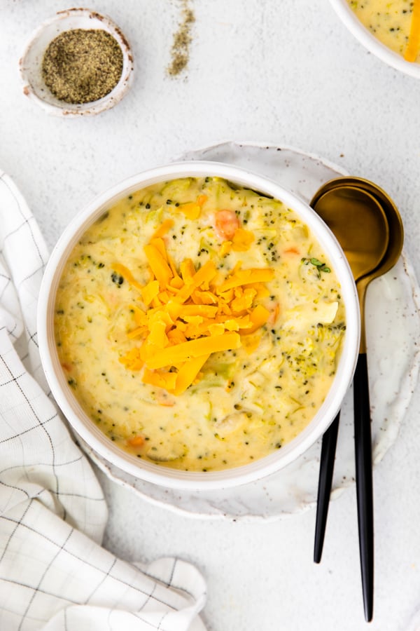 Instant Pot Broccoli Cheddar Soup served with extra cheese on top. 