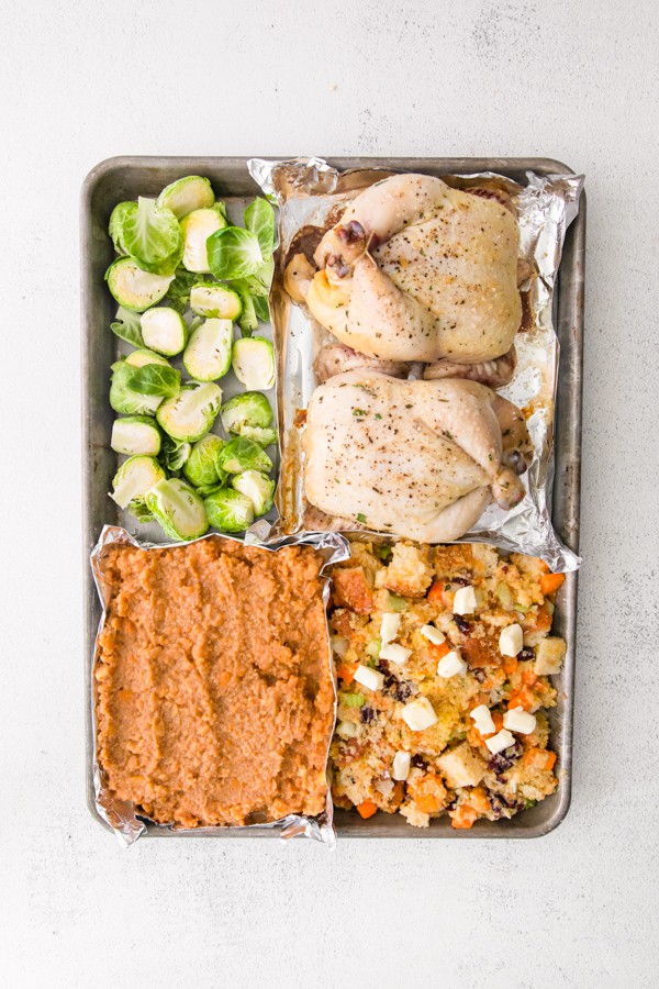 Sheet Pan Thanksgiving Dinner uncooked showing how to set it up on the sheet pan.