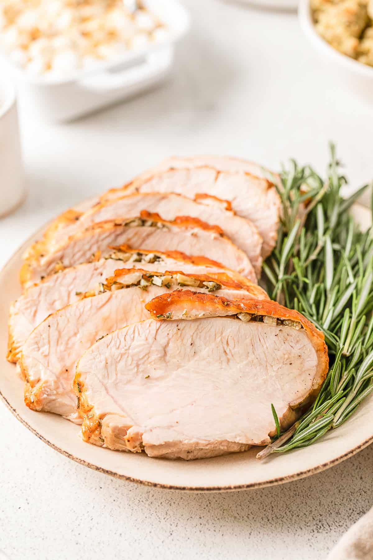 Air Fryer Turkey Breast sliced on a plate.