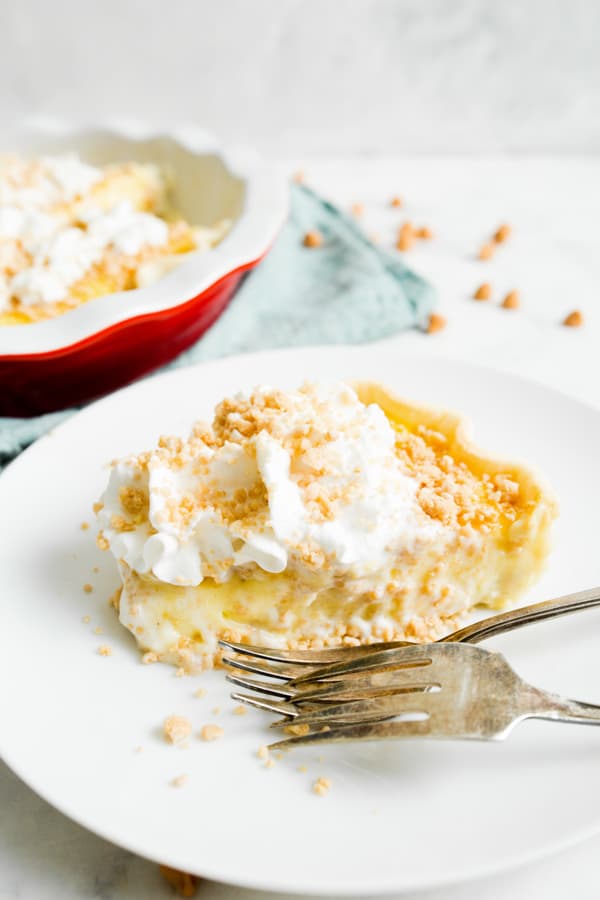 Amish Peanut Butter Pie sliced on a plate with a fork. 