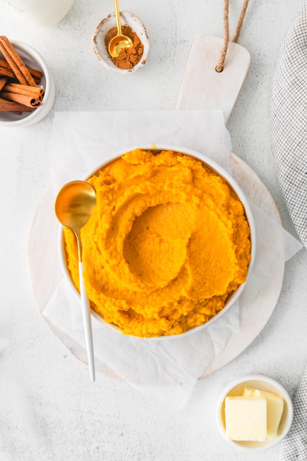 Instant Pot Mashed Sweet Potatoes in a bowl with a spoon. 