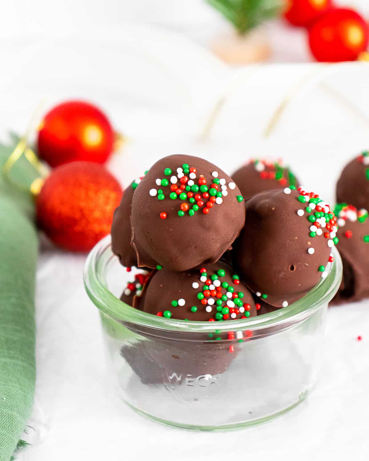 Christmas Oreo Truffles covered with red and green sprinkles.