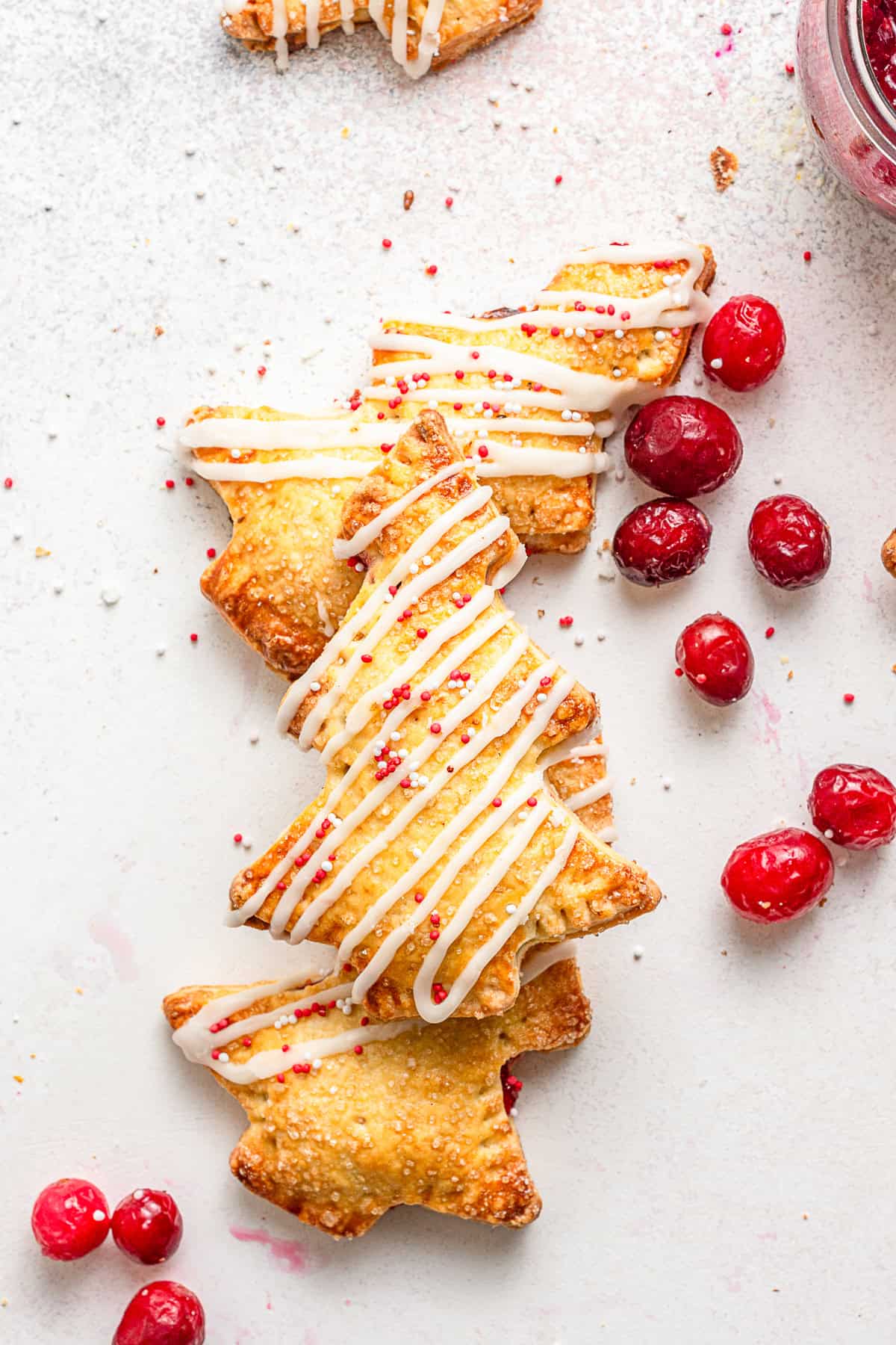 Cranberry Hand Pies drizzled with orange glaze. 