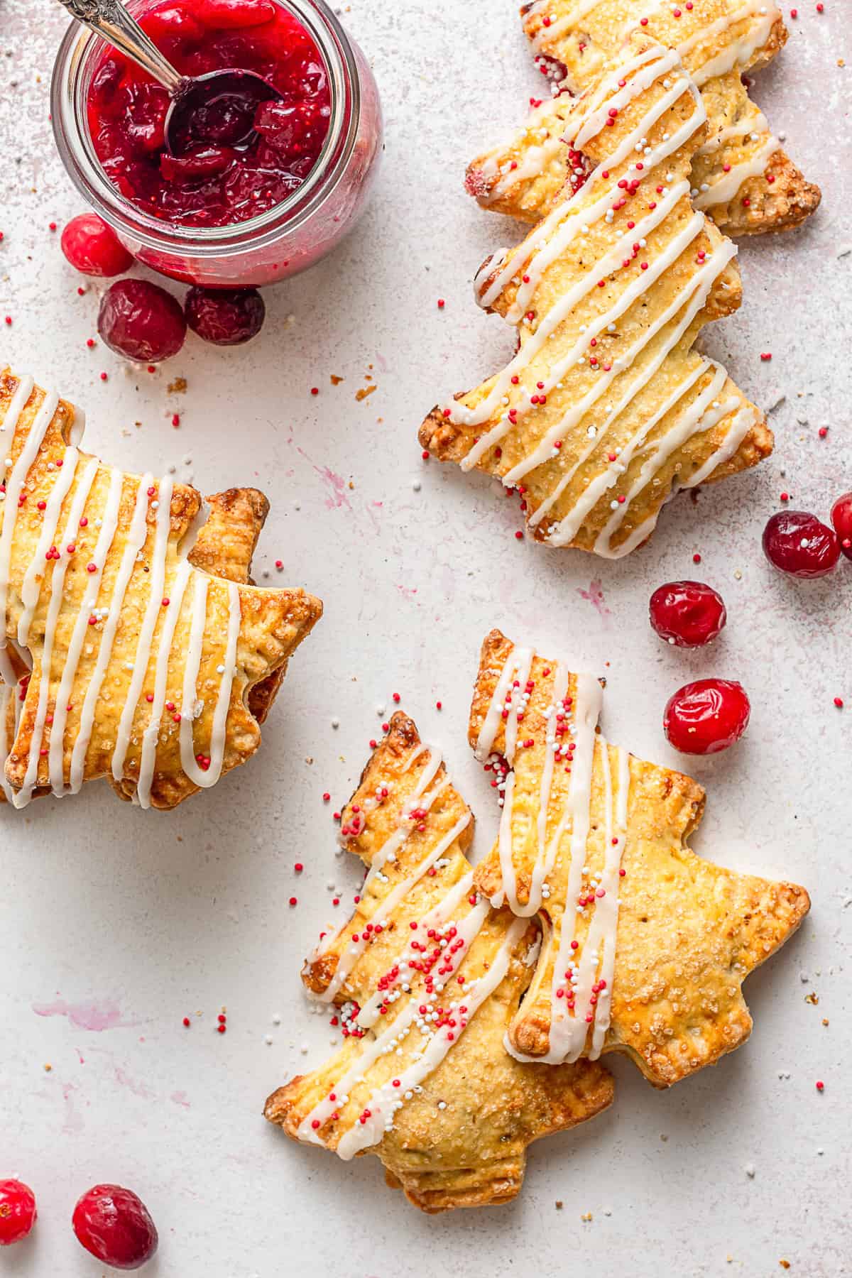 Cranberrry hand pie served with sweet drizzle and sprinkles. 