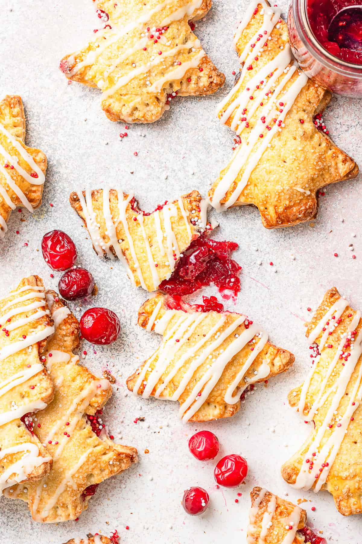 A cranberry hand pie cut in half to show the filling. 