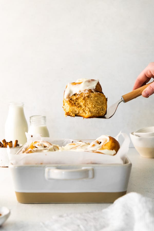 Gingerbread Cinnamon Rolls coming out of the pan. 