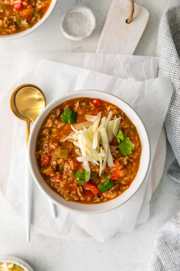 Instant Pot Stuffed Pepper Soup served with thick grated cheese.