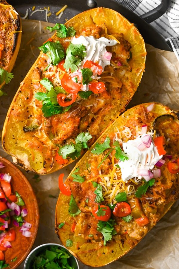 Ground Chicken Fajita Spaghetti Squash topped with sour cream, tomatoes, and cilantro. 