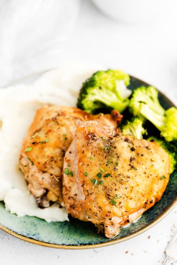 Air Fryer Chicken Thighs on a ceramic plate. 