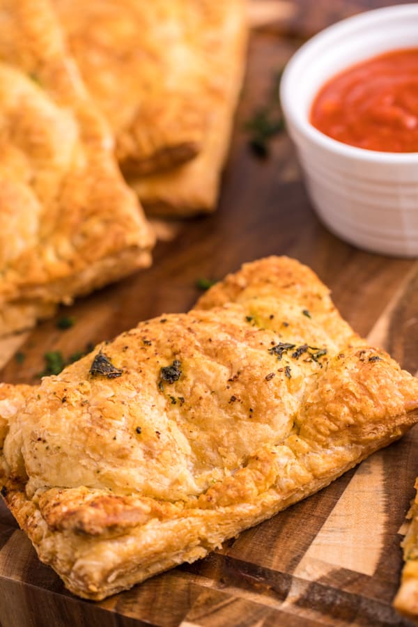 Air Fryer Hot Pockets on a board with dipping sauce.