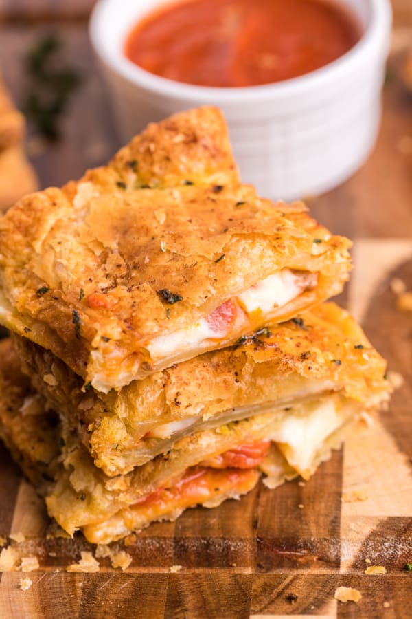 Sliced Air Fryer Hot Pockets on a serving board.