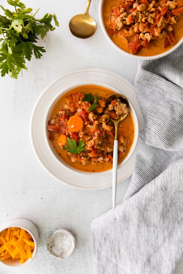Instant Pot Ground Chicken Chili sitting in a white bowl. 