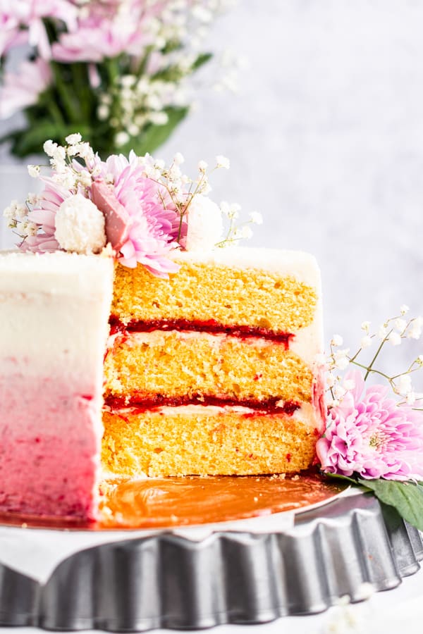 Sliced Strawberry Coconut Layer Cake to show the layers. 