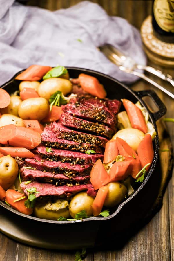 Instant Pot Corned Beef sliced in a serving dish. 