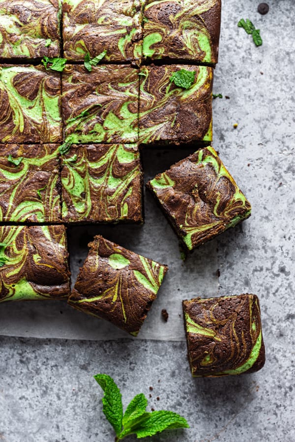 Swirled Mint Cream Cheese Brownies cut on on a serving board.