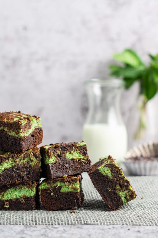 Swirled Mint Cream Cheese Brownies stacked. 