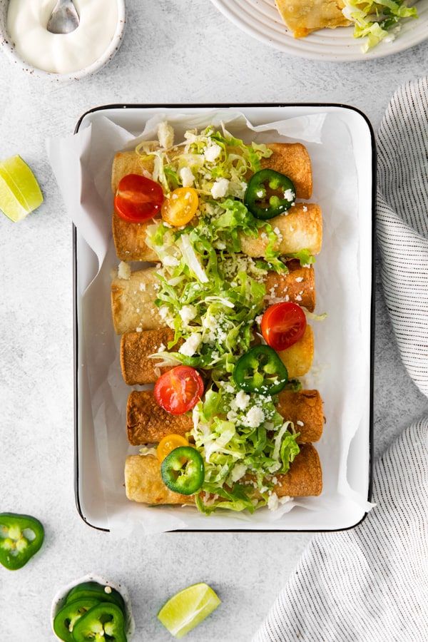 Air Fryer Chicken Taquitos served in a dish.