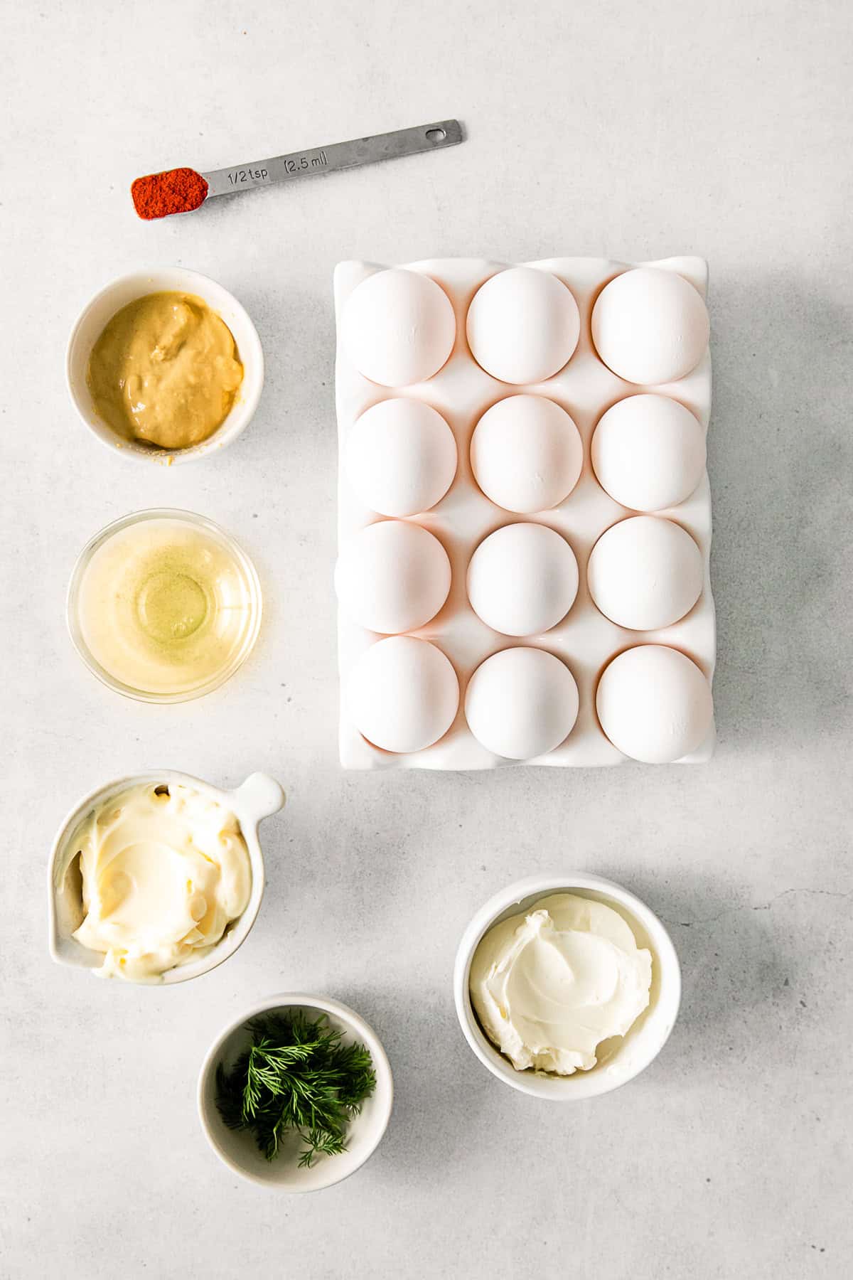 Ingredients to make Classic Deviled Eggs on a table. 