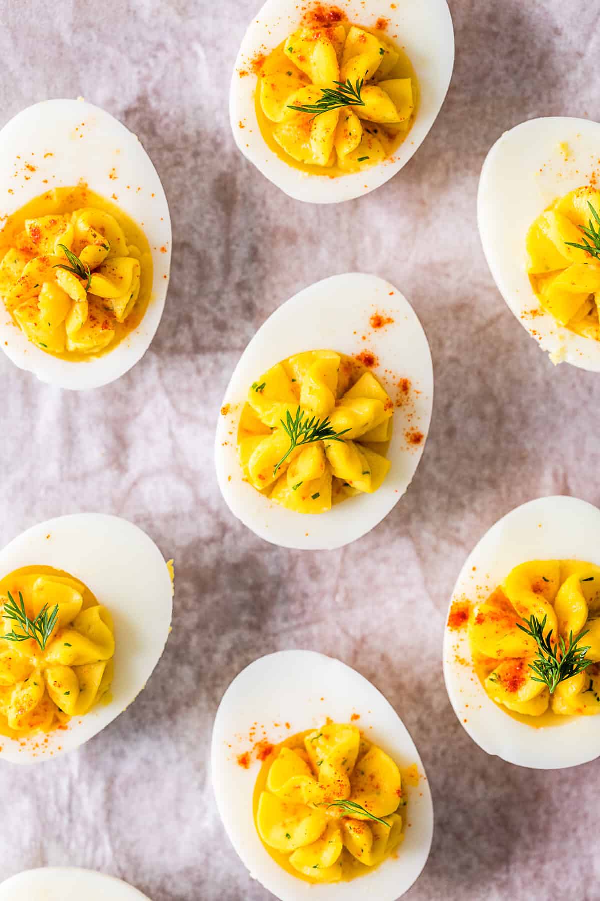 Classic Deviled Eggs topped with paprika and dill. 