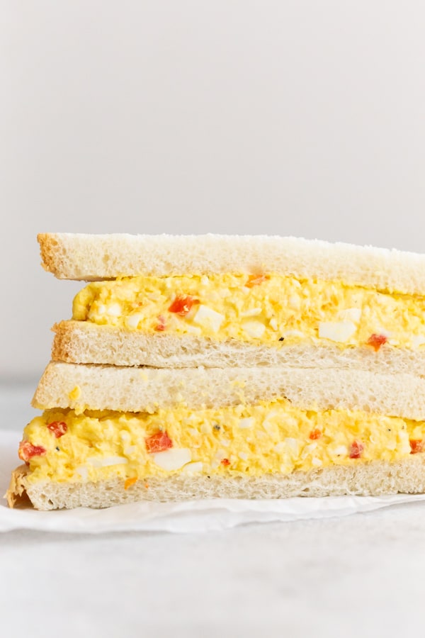 A cut in half Pimento Cheese Egg Salad sandwich.