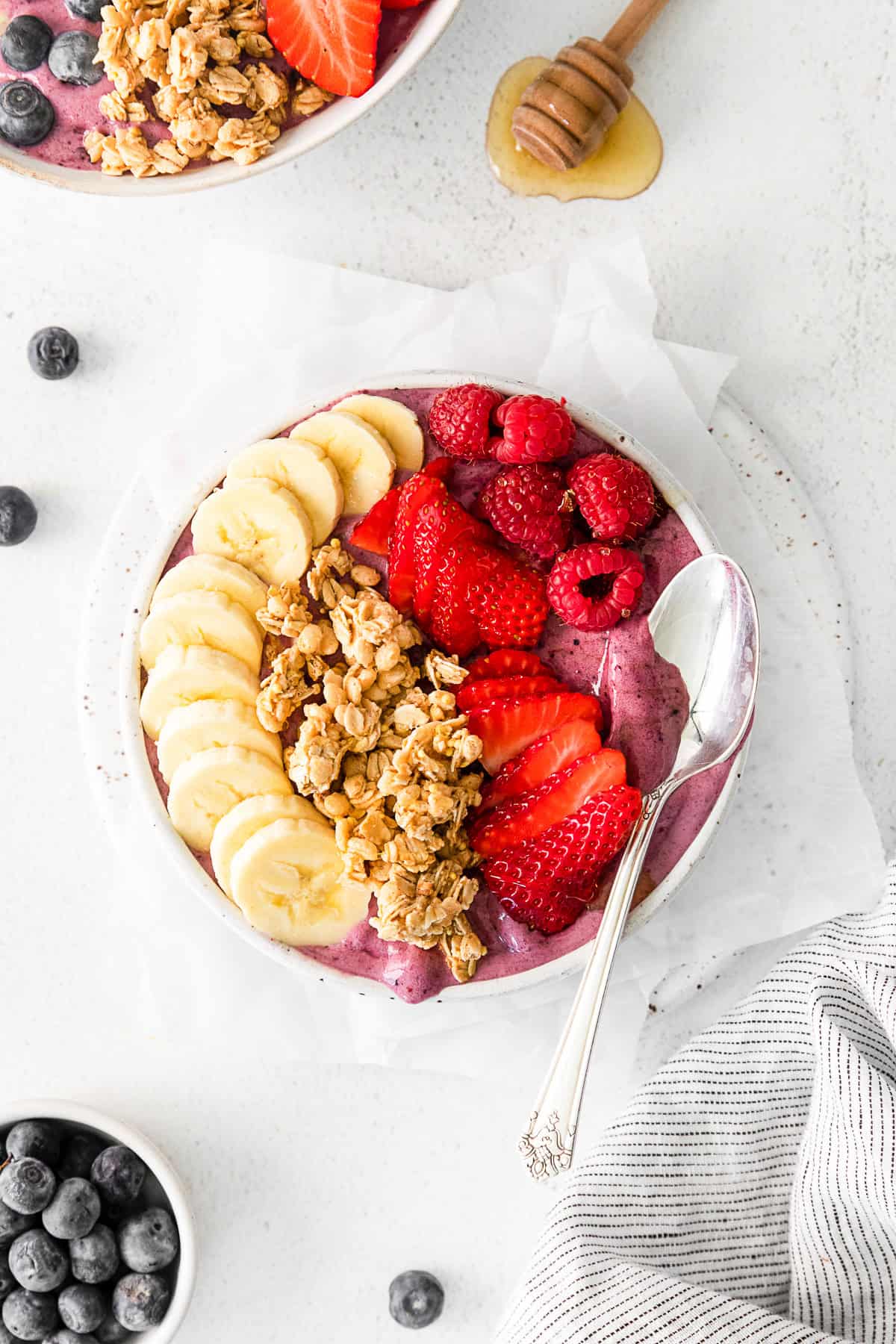 Acai Bowl topped with fresh fruit and granola.