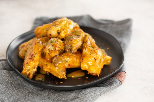 Air Fryer Honey Mustard Chicken Wings on a plate.