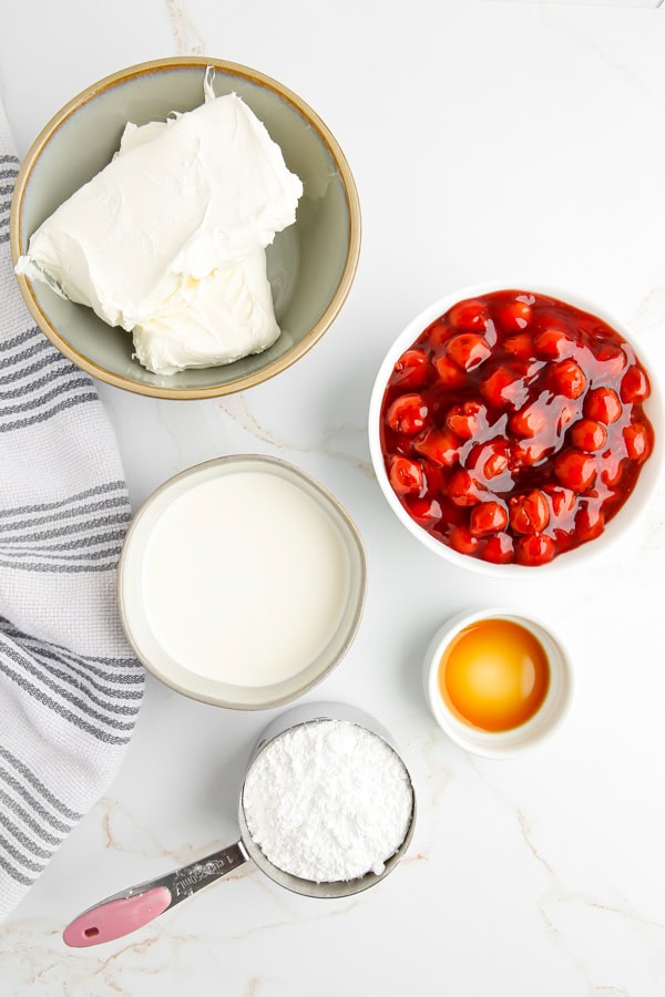 Ingredients to make Cherry Cheesecake Dip on a table.