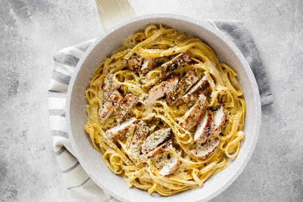 Chicken Fettuccine Alfredo in a skillet.
