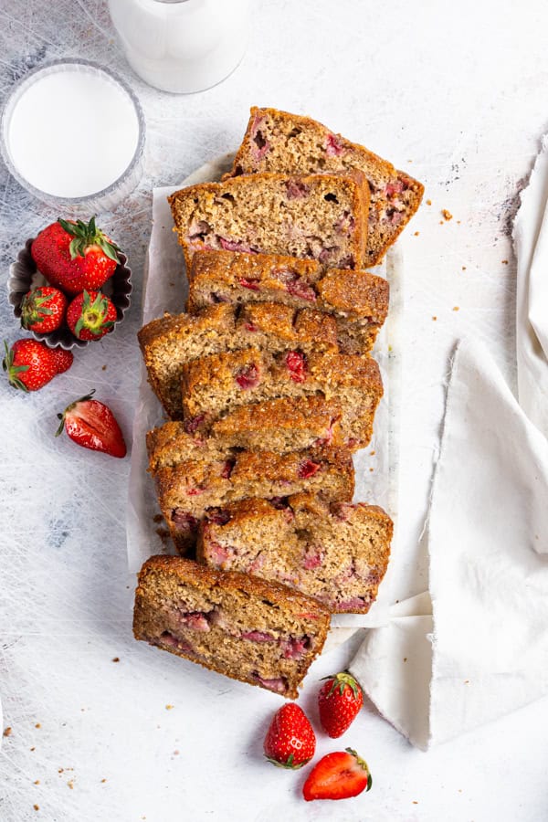 Fresh Strawberry Bread sliced on a board.