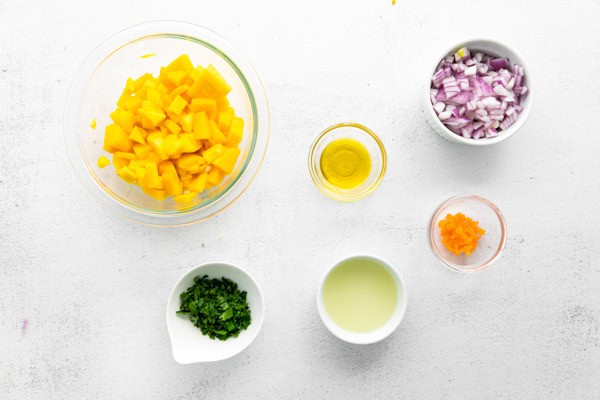 Mango Habanero Salsa ingredients on a table. 