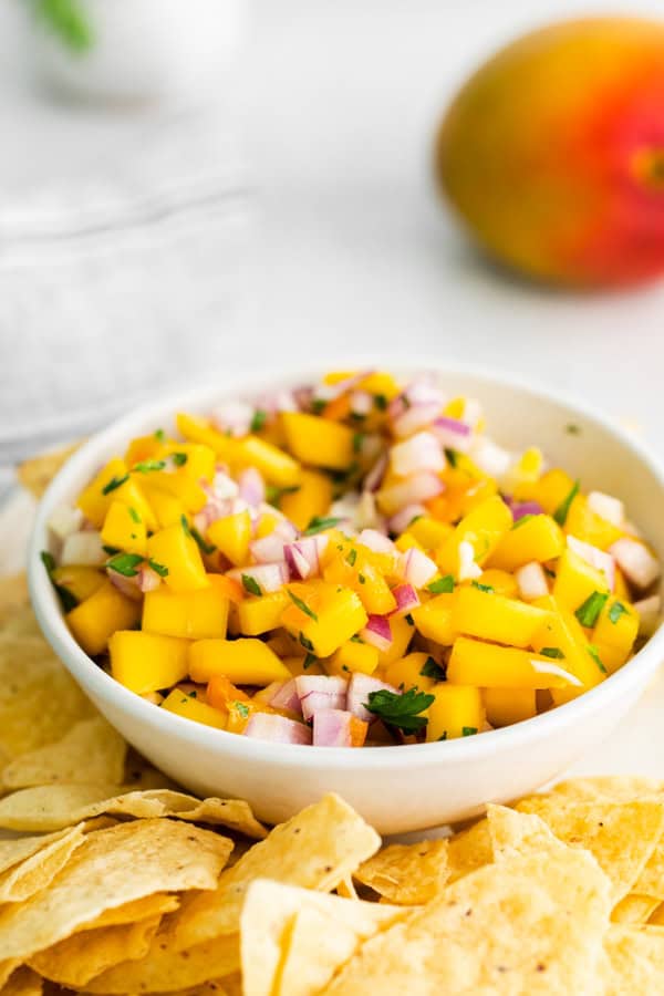 Mango Habanero Salsa in a bowl with corn chips. 