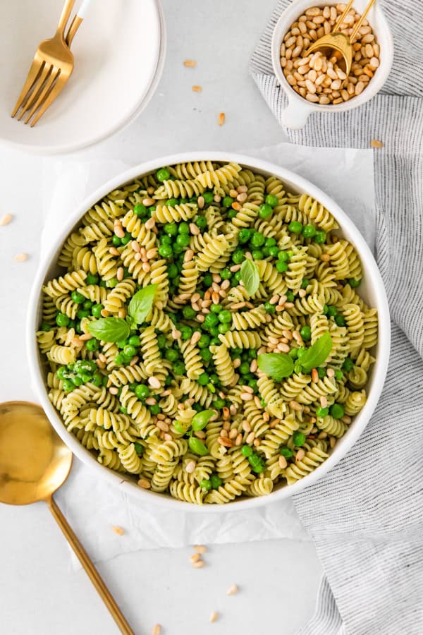 Pesto Pasta Salad in a large white serving bowl. 