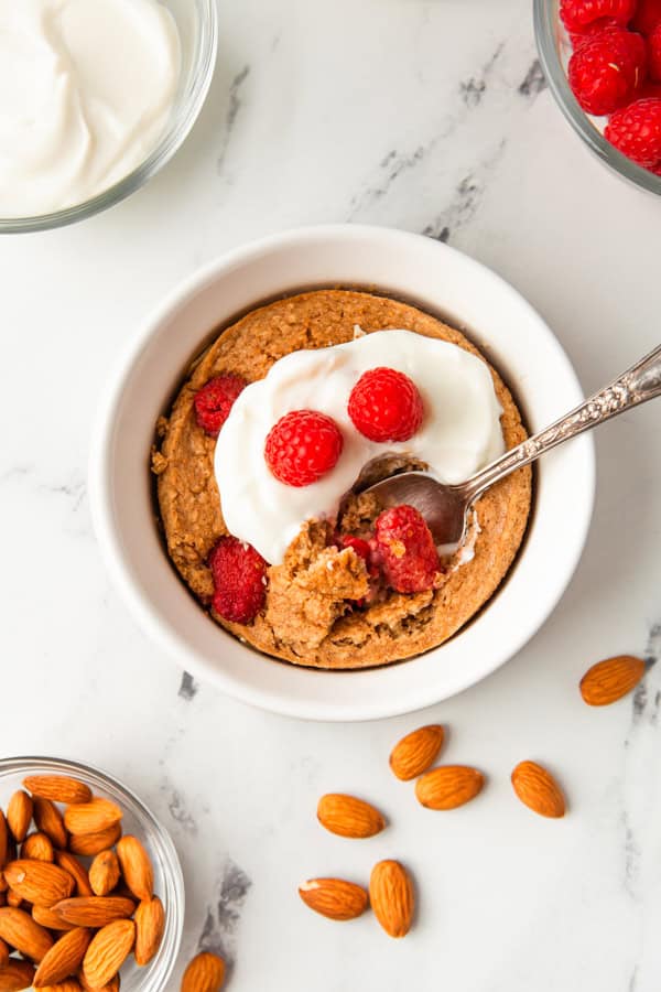 Baked Raspberry Oatmeal topped with Greek yogurt.