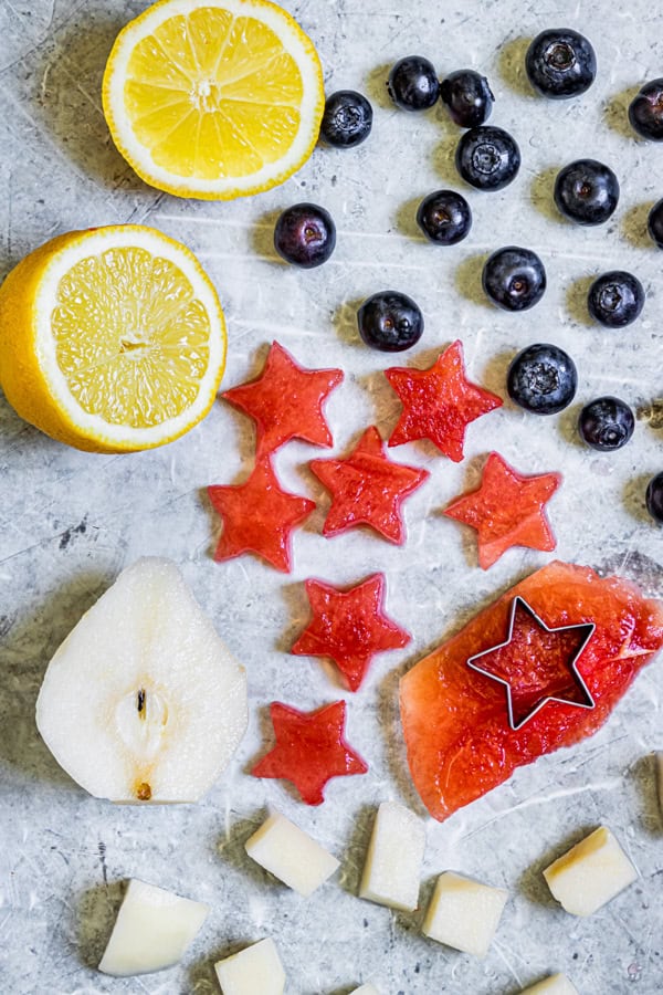 Fruit sitting on a cutting board. 