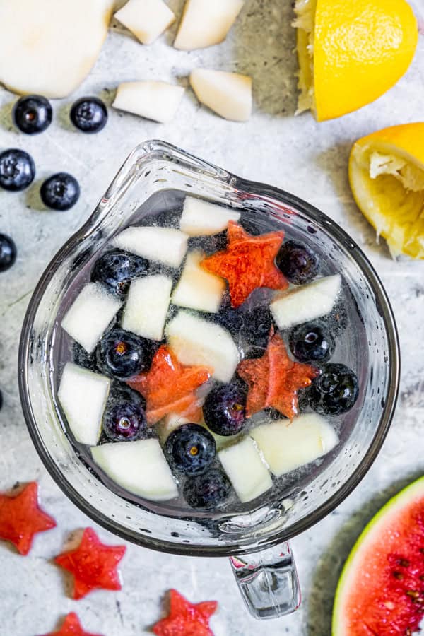 Patriotic Lemonade in a glass pitcher. 