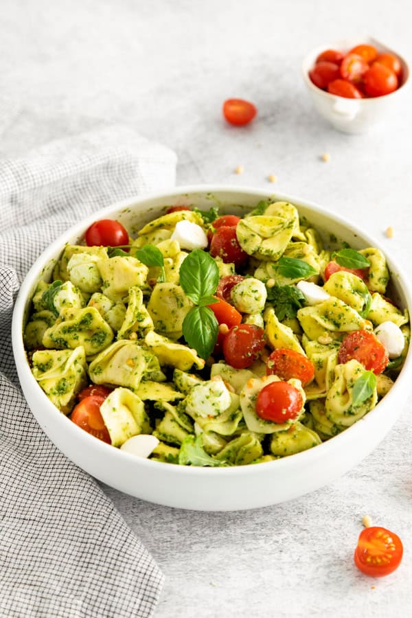 Pesto Tortellini Salad in a white bowl.
