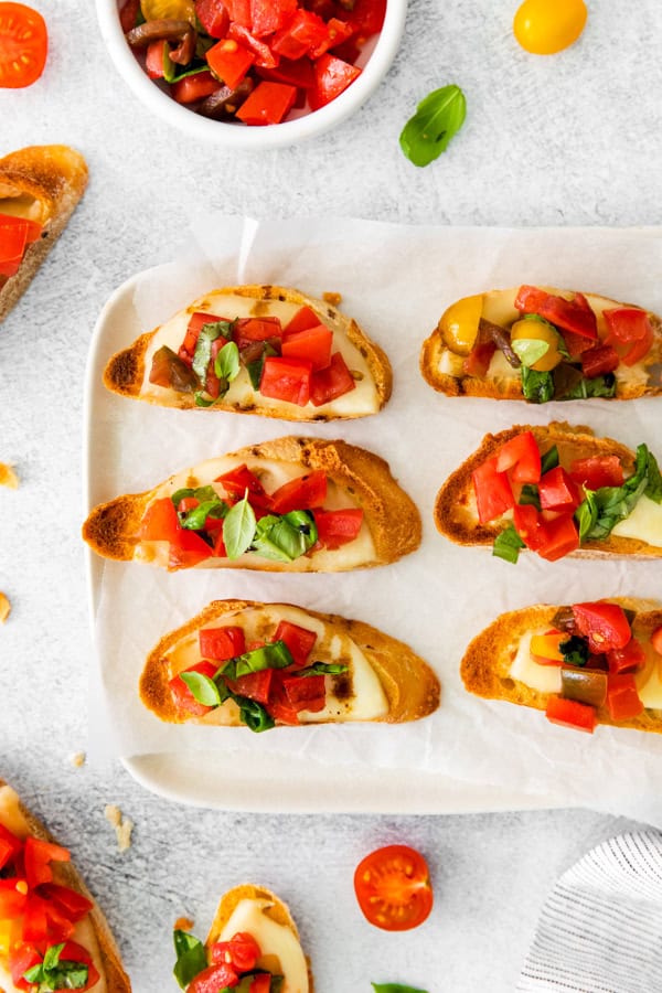 Caprese Bruschetta on a white plate. 