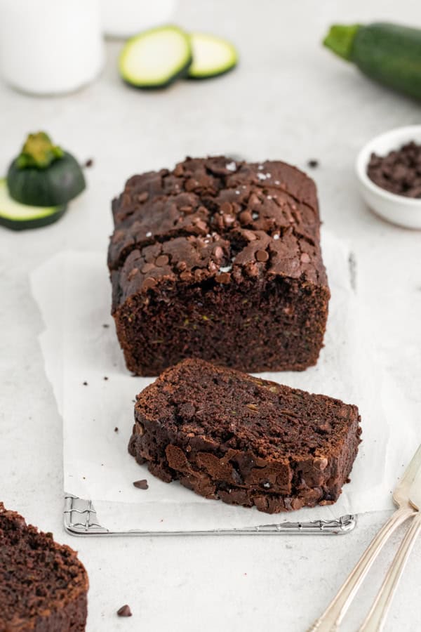A slice of Chocolate Zucchini Bread on a table.