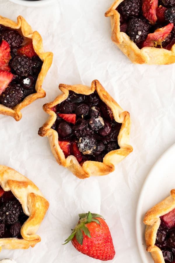 Mini Berry Galettes on parchment paper. 