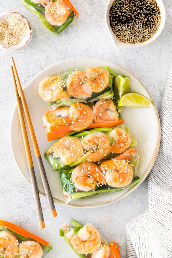 Shrimp Summer Rolls on a plate with chopsticks. 