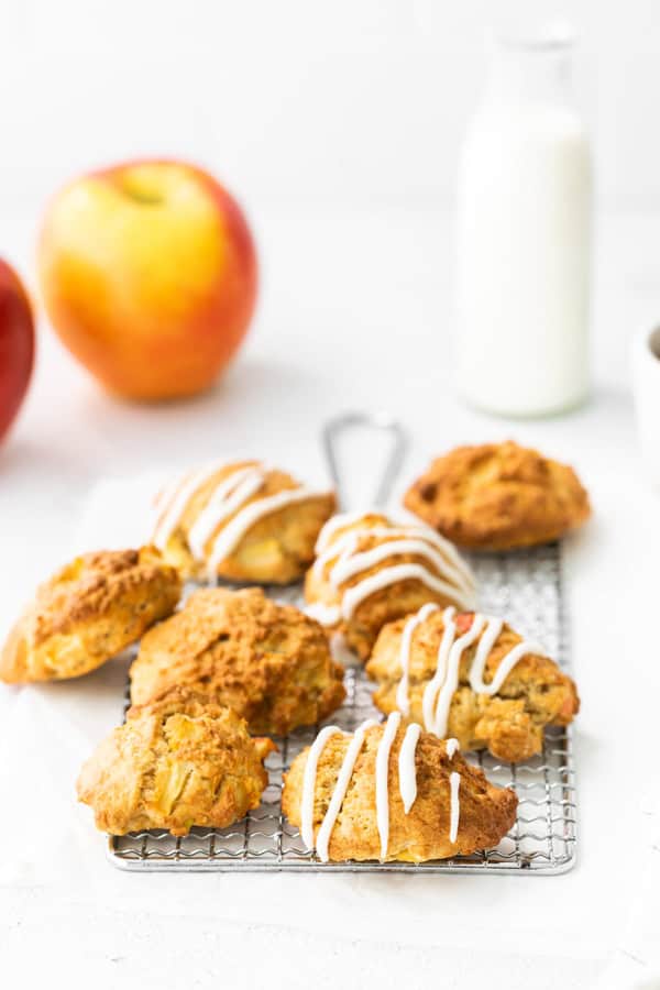 apple fritters on a white table.