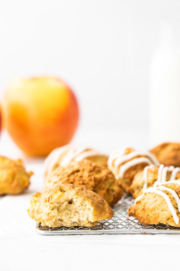 An air fryer apple fritter with a bite taken out of it.