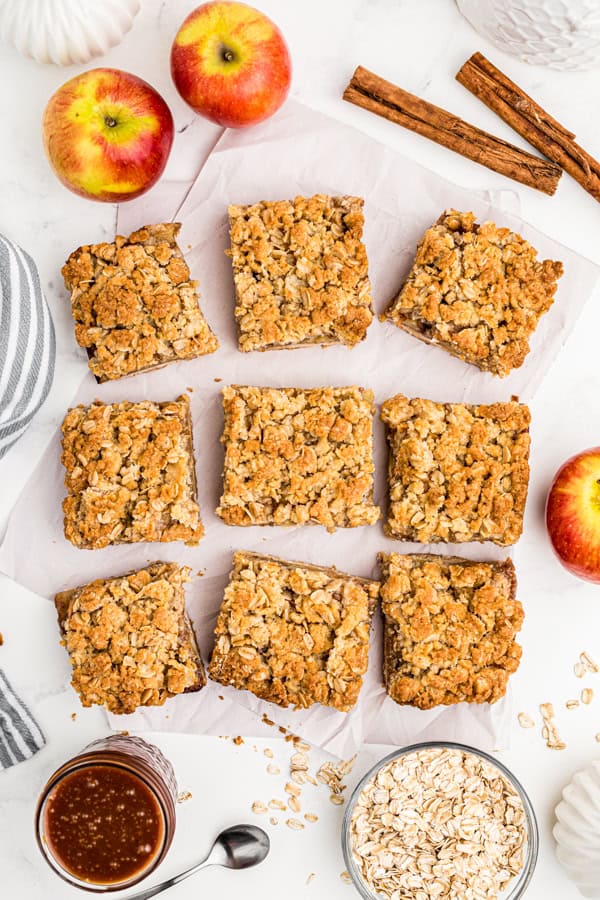 Apple Pie Bars cut and served on parchment paper.