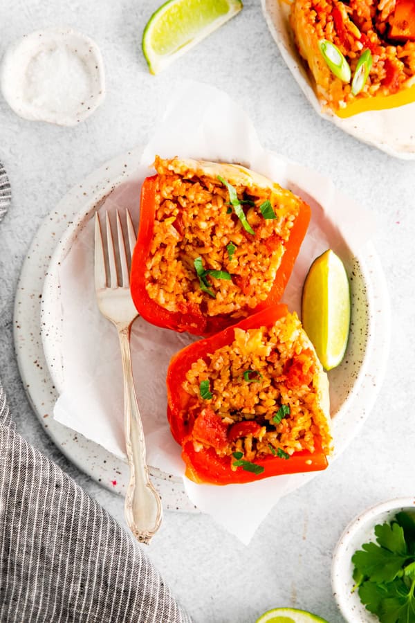 Instant Pot Stuffed Peppers cut in half on a plate. 