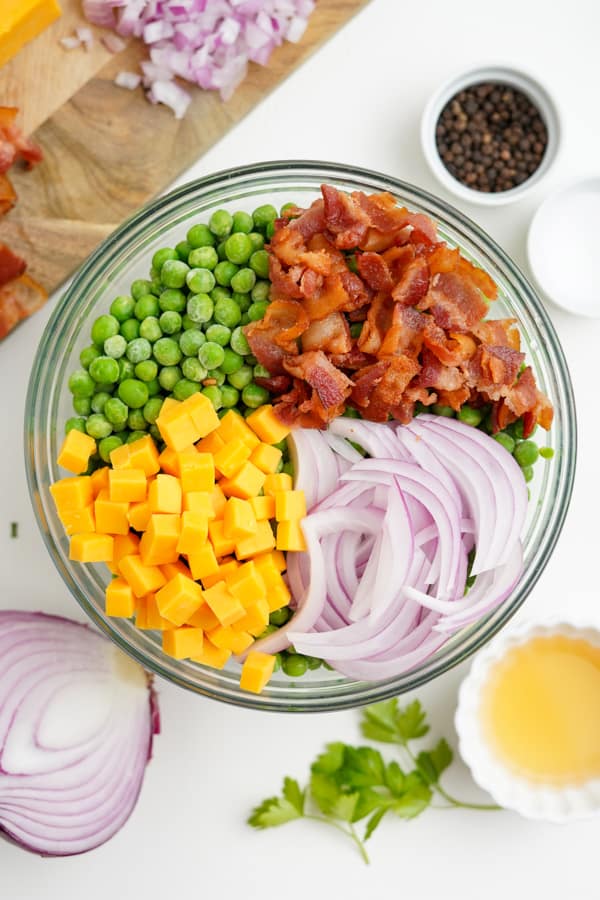 Classic Pea Salad ingredients in a bowl not yet stirred. 