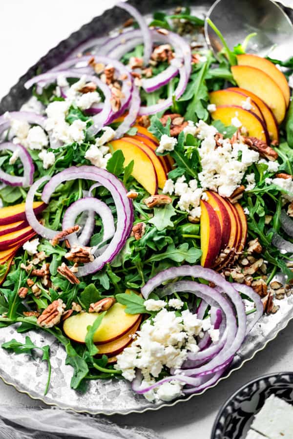 Peach Feta Salad on a salad serving dish. 